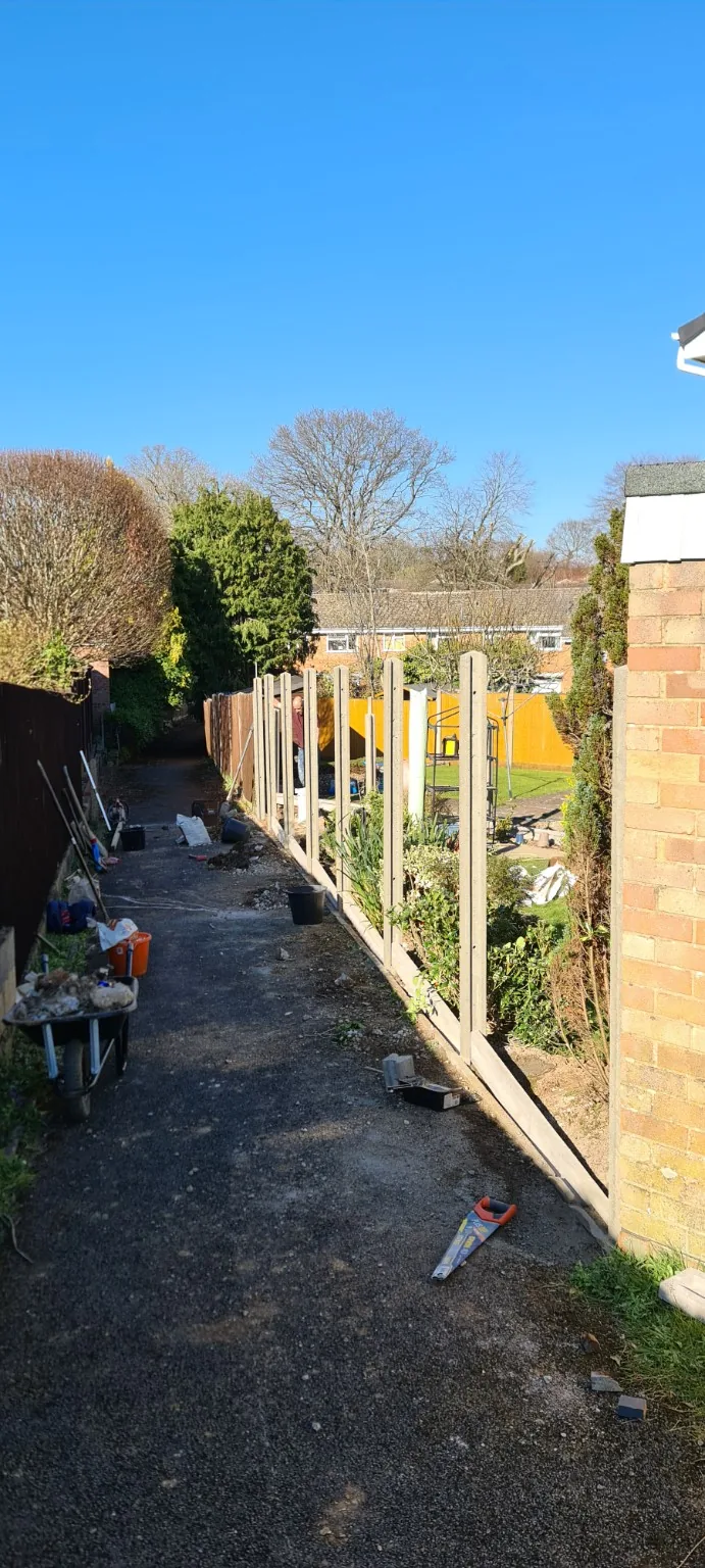 Fence posts installed during a longer fencing job