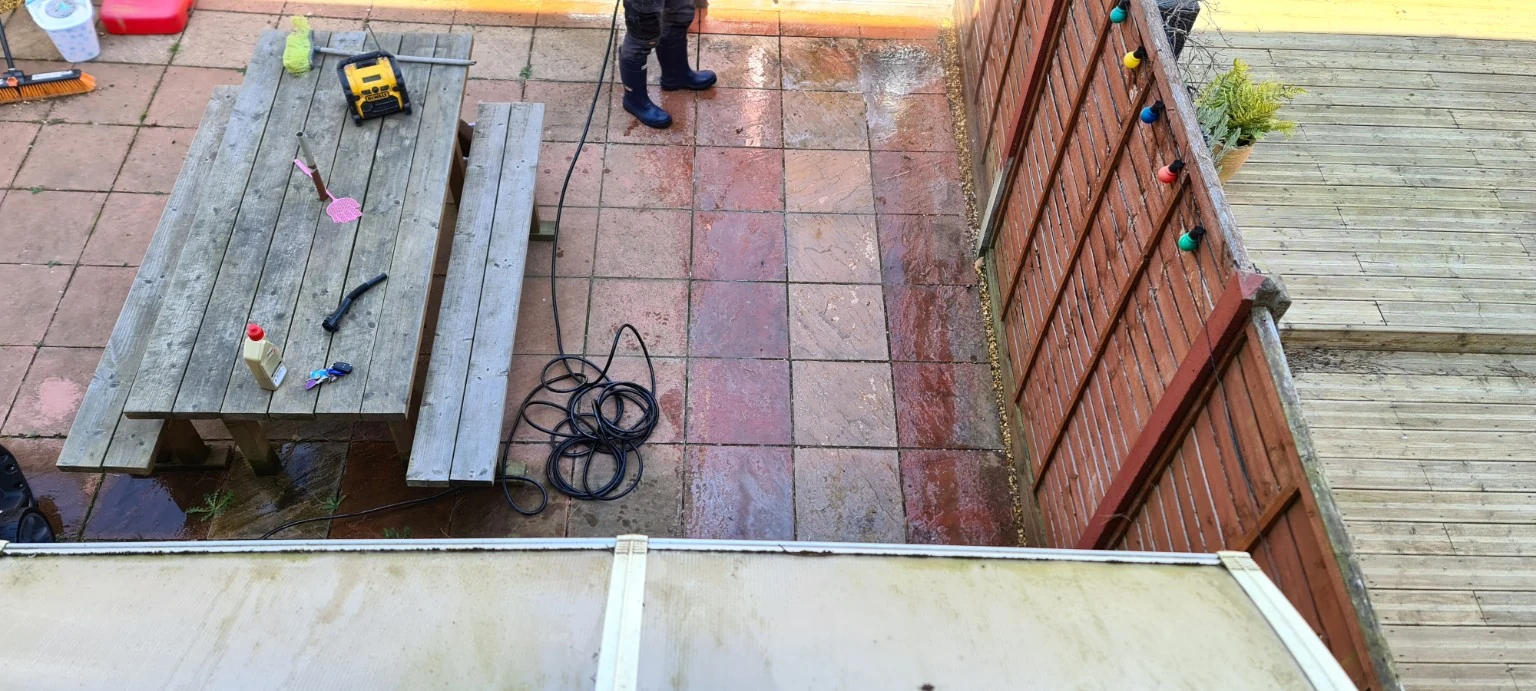 Patio halfway cleaned during the job